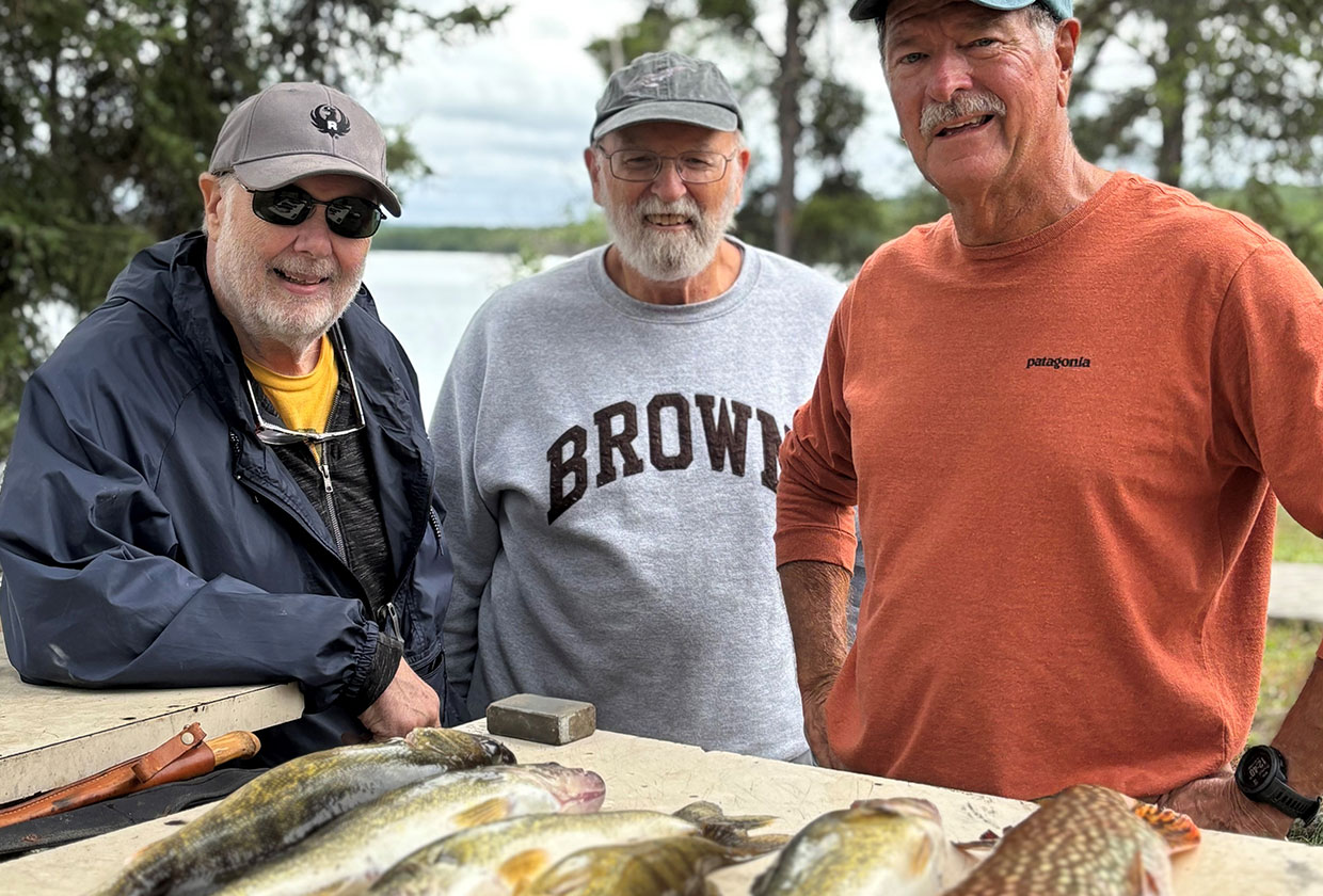 Admiring their catch for lunch